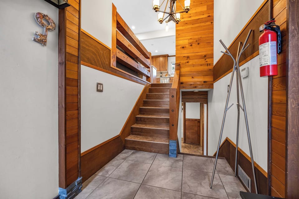 Entrance Foyer: Stairs leads to main floor and lower floor