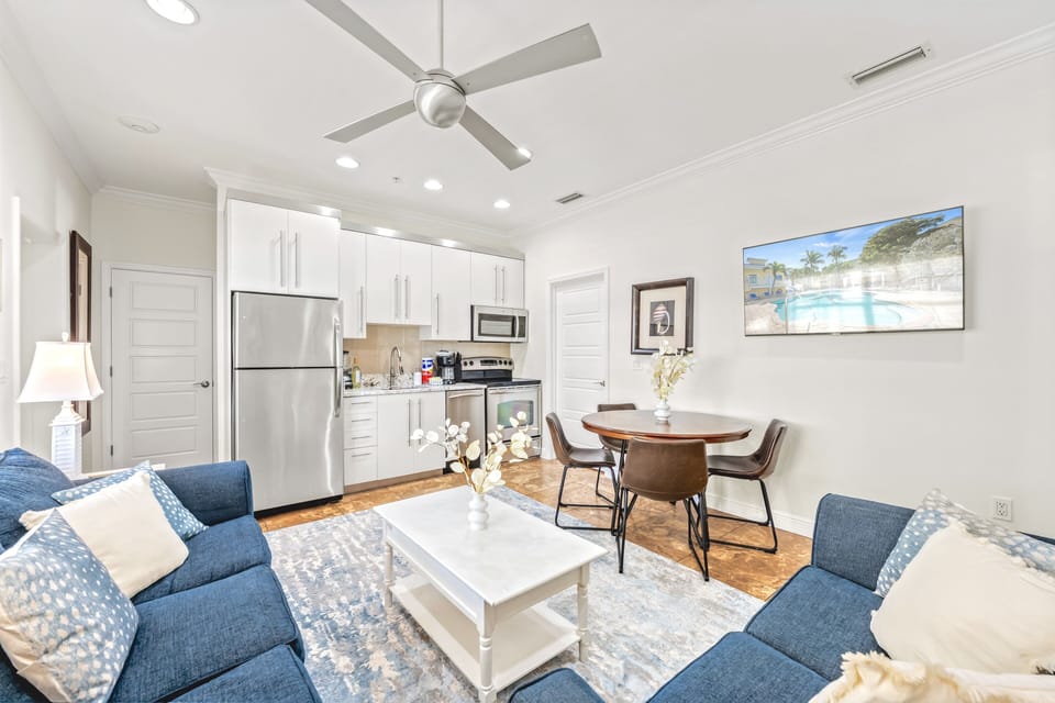 Living area leading to kitchen and dining.