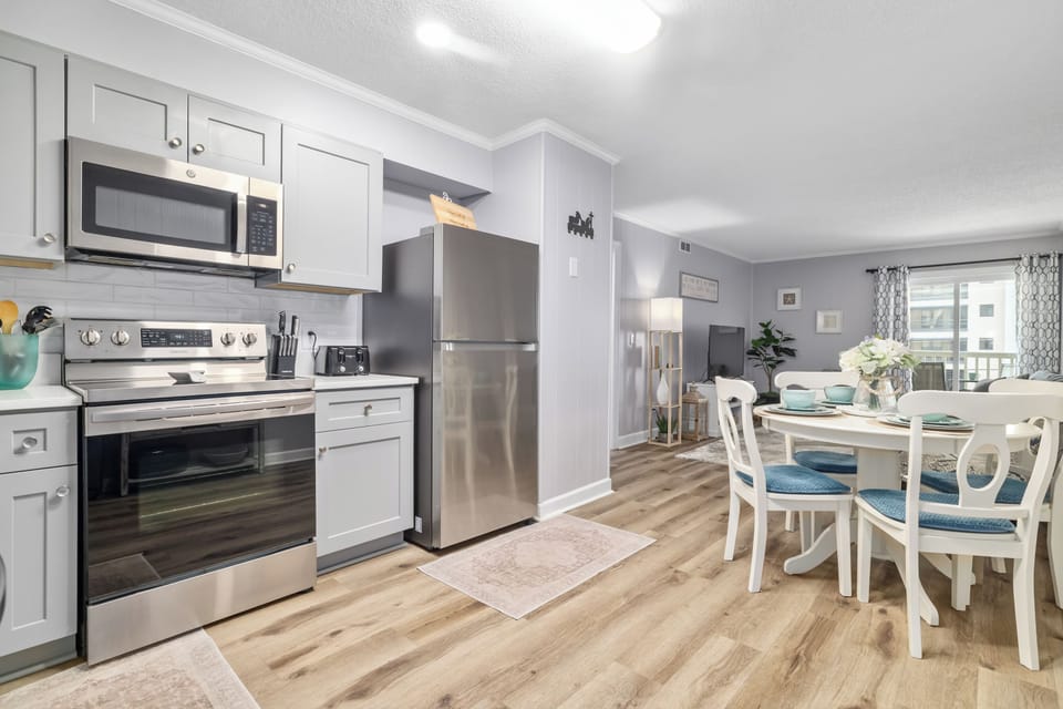 Updated fully stocked kitchen, with heat in dining space for four