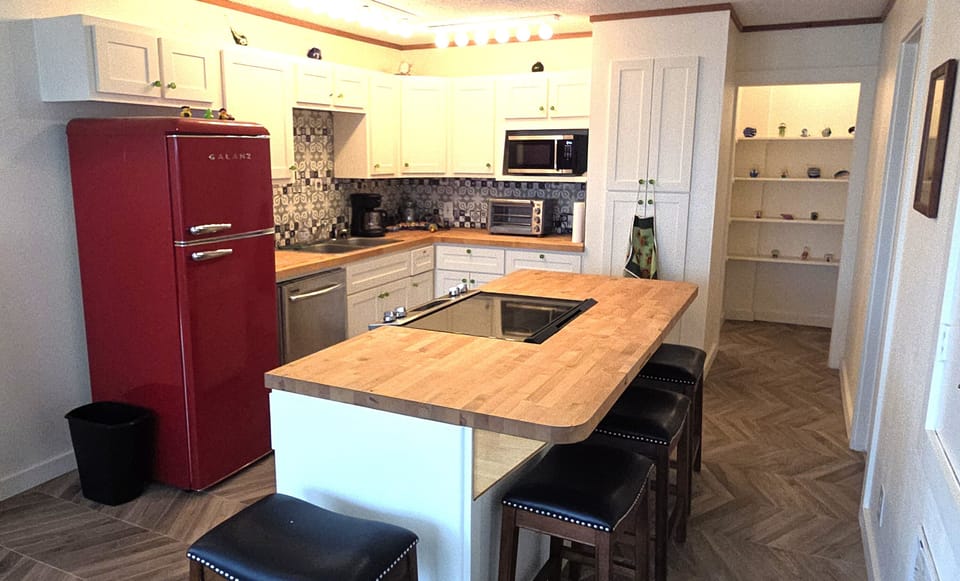 The cottage has unique custom tile and decor that will take you back in time.