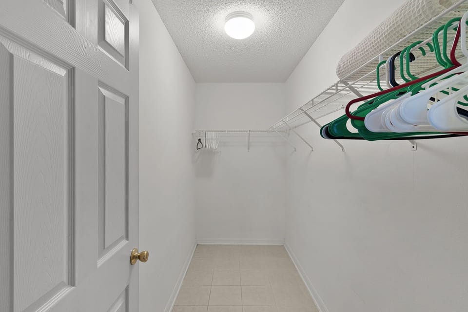 Your spacious walk-in closet offers plenty of room to unpack and organize your belongings during your stay.