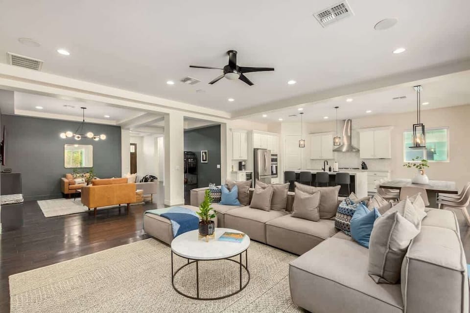 Expansive, open floor plan with 11 foot ceilings and whole house Sonos audio system. Layout of main living area enables togetherness for families/groups in 3 separate, but connected, living spaces.