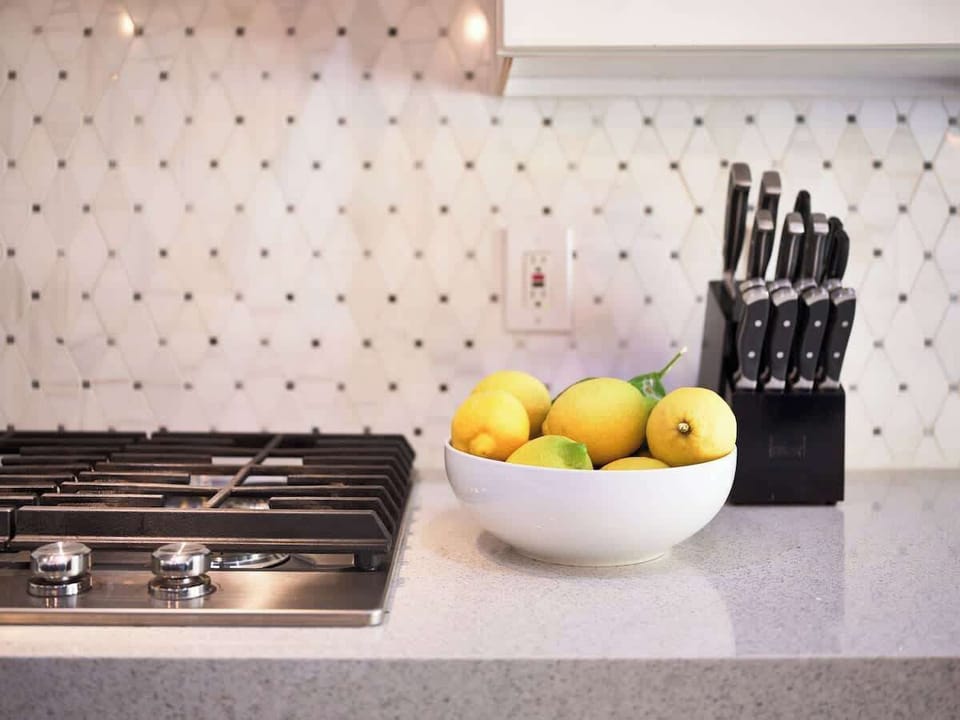 6-burner Bosch gas cooktop and lemons from the back garden.