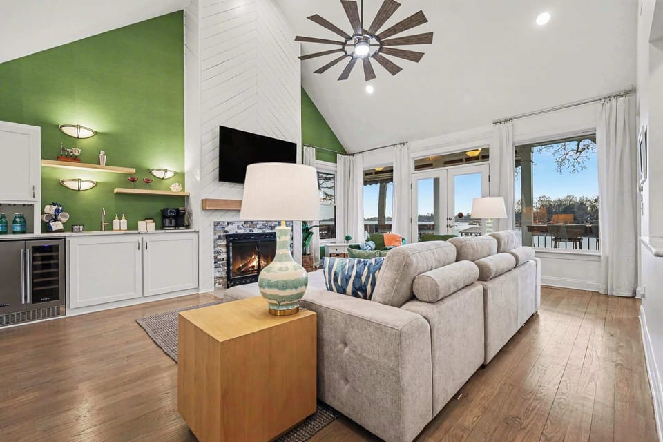 At the center of the home, the living room offers an open, light-filled space perfect for gathering and unwinding. Settle in after a day on the lake, stream your favorite shows, or savor a peaceful sunrise over the water.