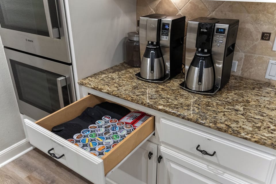 Dual drip coffee makers plus Keurig machine on counter
