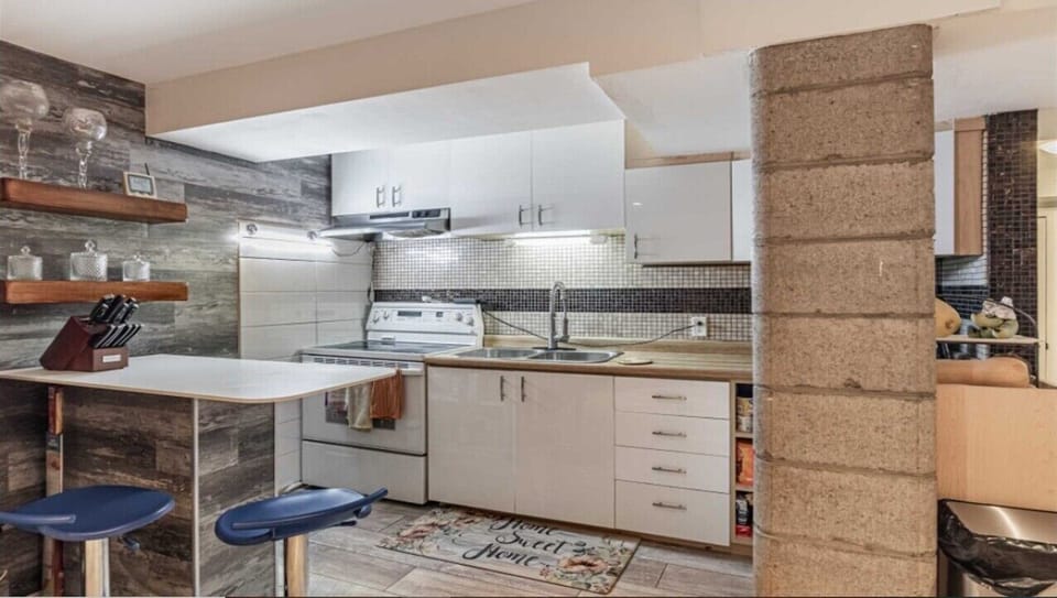 Kitchen with Stove top, oven, microwave, Coffee maker, Bread toaster etc
