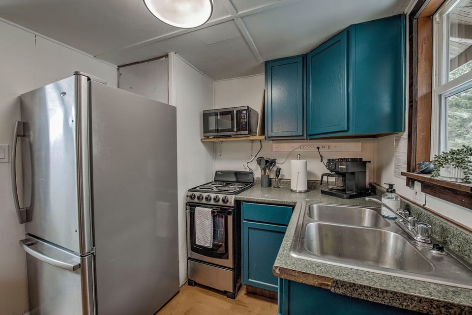 Whip up your favorites in your compact kitchen—modern appliances, ample counter space, and everything you need to make meals feel easy and yours. Complete with a Keurig coffee maker for both grounds and K-Cups. 