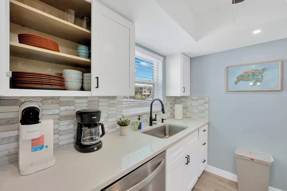 The kitchen includes both a traditional coffee maker and a Keurig.
