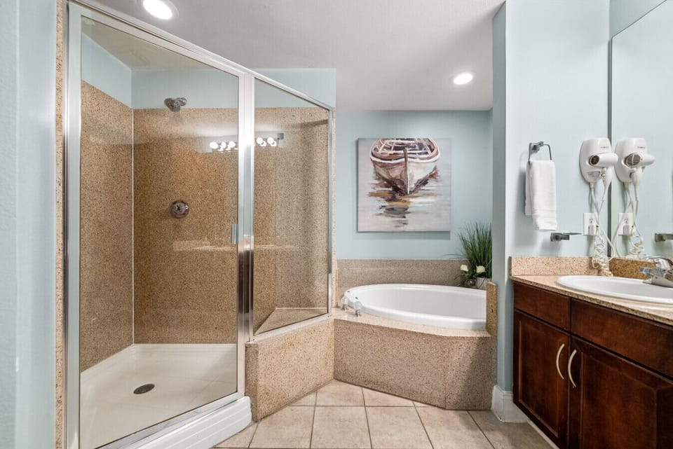 Relax in the spa-style bathroom featuring a walk-in shower and large soaking tub