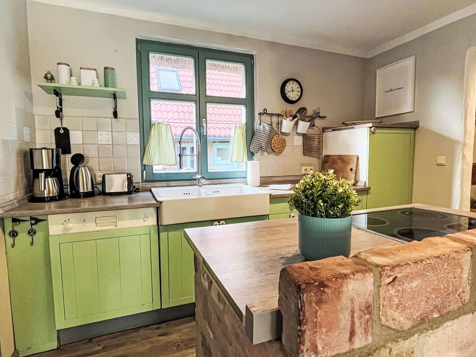 Kitchen, Countertop, Furniture, Interior Design, Cabinetry, Flooring, Kitchen Appliance, Wood, Floor, Major Appliance