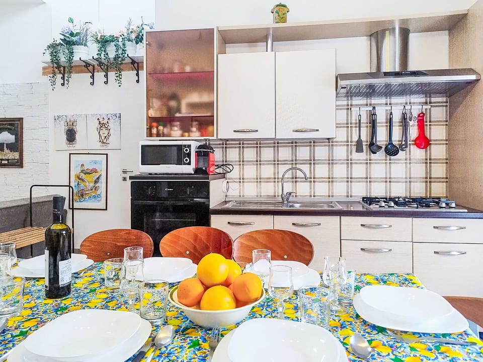 Furniture, Interior Design, Kitchen, Flooring, Countertop, Kitchen Appliance, Major Appliance, Room, Floor, Lighting
