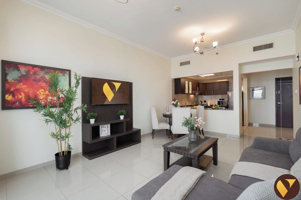Luxury Apartment, Balcony, City View | Living area | 65-inch Smart TV with cable channels