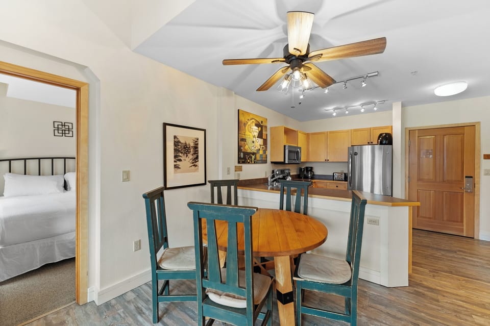 Your open-concept space flows from cozy dining to modern kitchen, perfect for memorable meals together.
