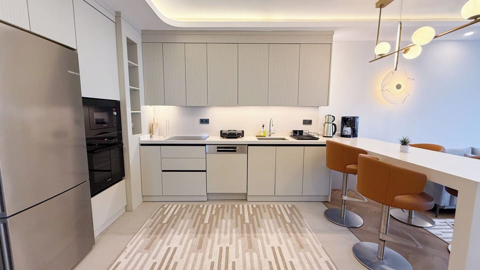 Deluxe Condo, City View | Desk, laptop workspace, iron/ironing board, free WiFi