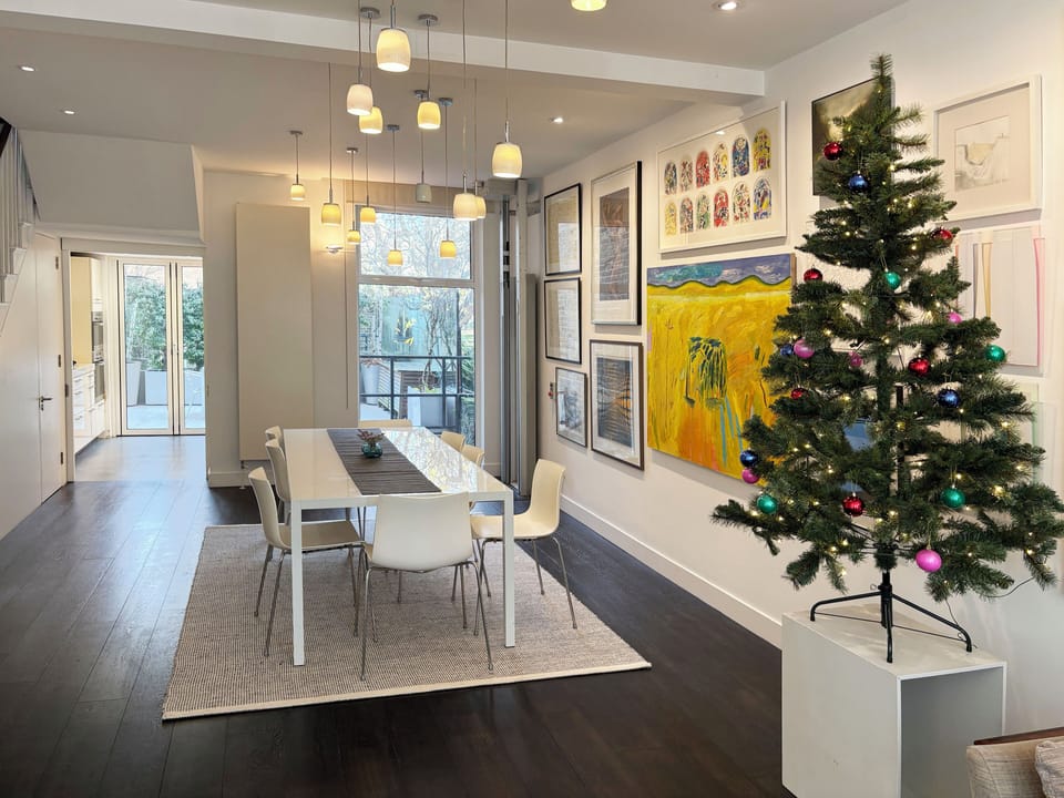 Dining table seating 8 guests comfortably, with flexibility for up to 10.