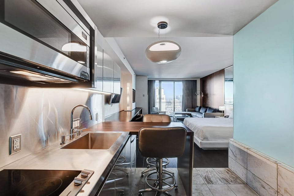 Deluxe Studio Suite, City View | Private kitchen | Coffee/tea maker, dining tables