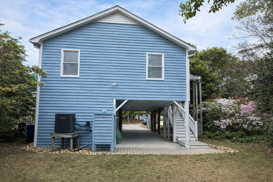 Back of house with hot/cold shower