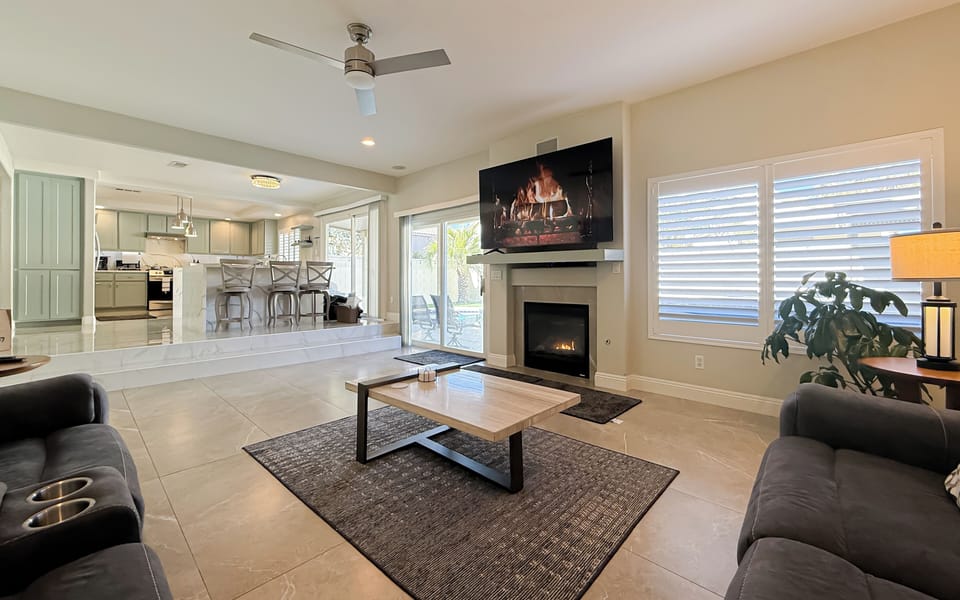 Family room with 75" Smart TV, surround sound, and Bluetooth connectivity