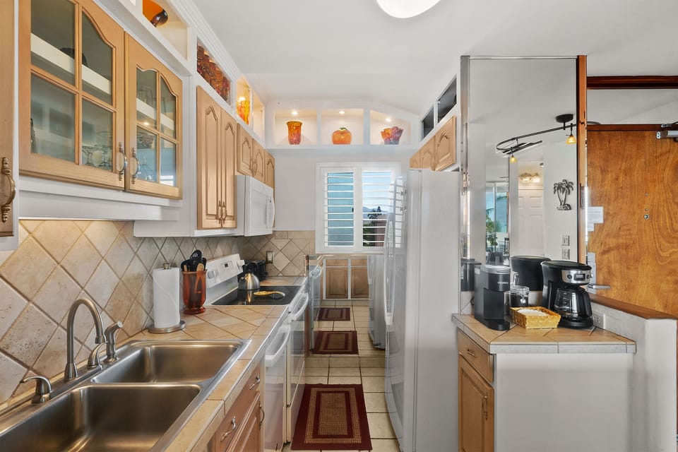 Condo, Multiple Beds, Lanai, Ocean View (Menehune Shores 606) | Private kitchen | Coffee/tea maker