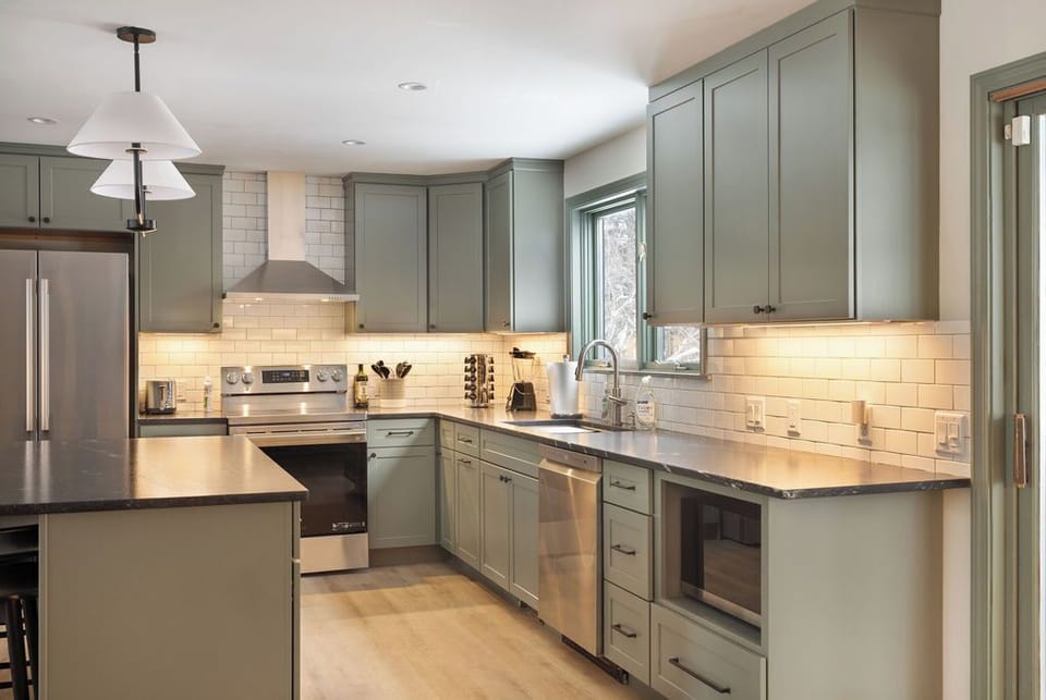 Bright, spacious kitchen with ample workspace and natural light - designed so everyone can help without feeling crowded.