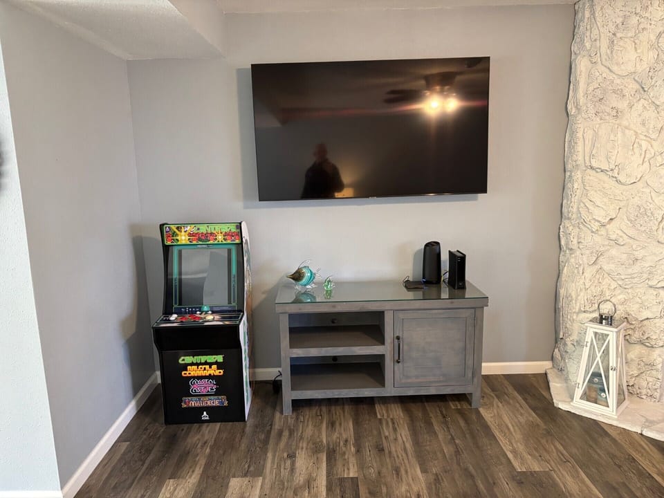 Roku TV, Free high-speed W-Fi, mini arcade game.  Board games located in cabinet