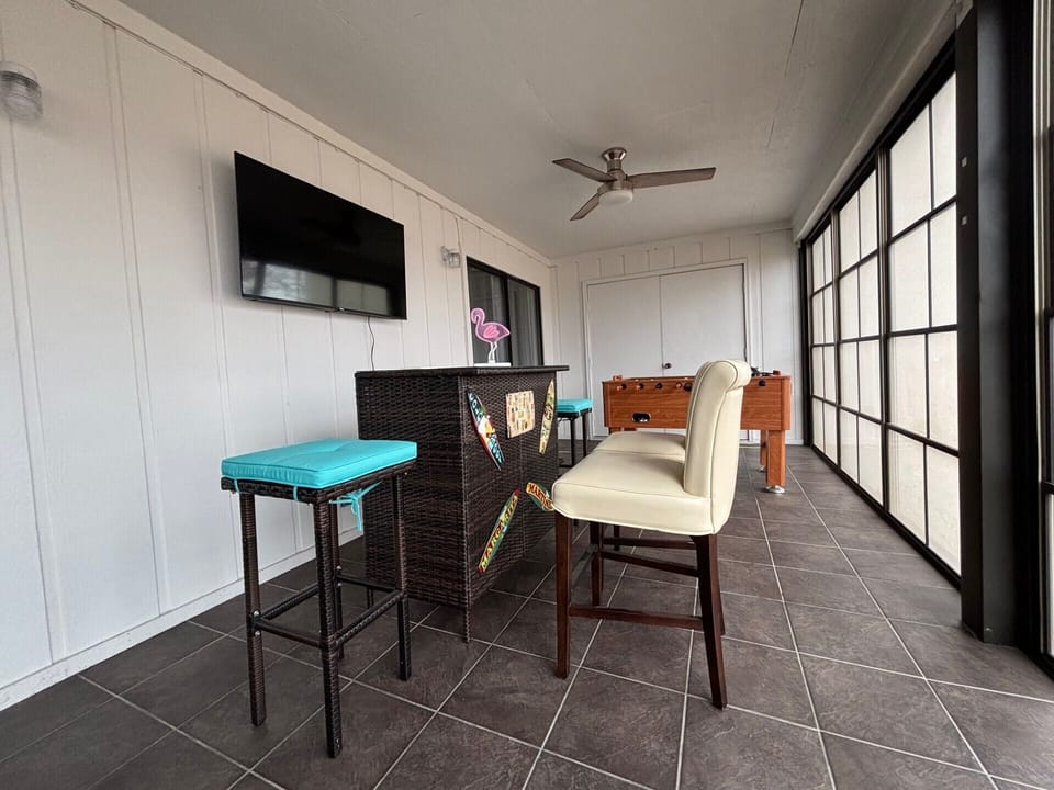 All Season Room. Foosball.  Tiki Bar.  Roku TV (Spectrum).