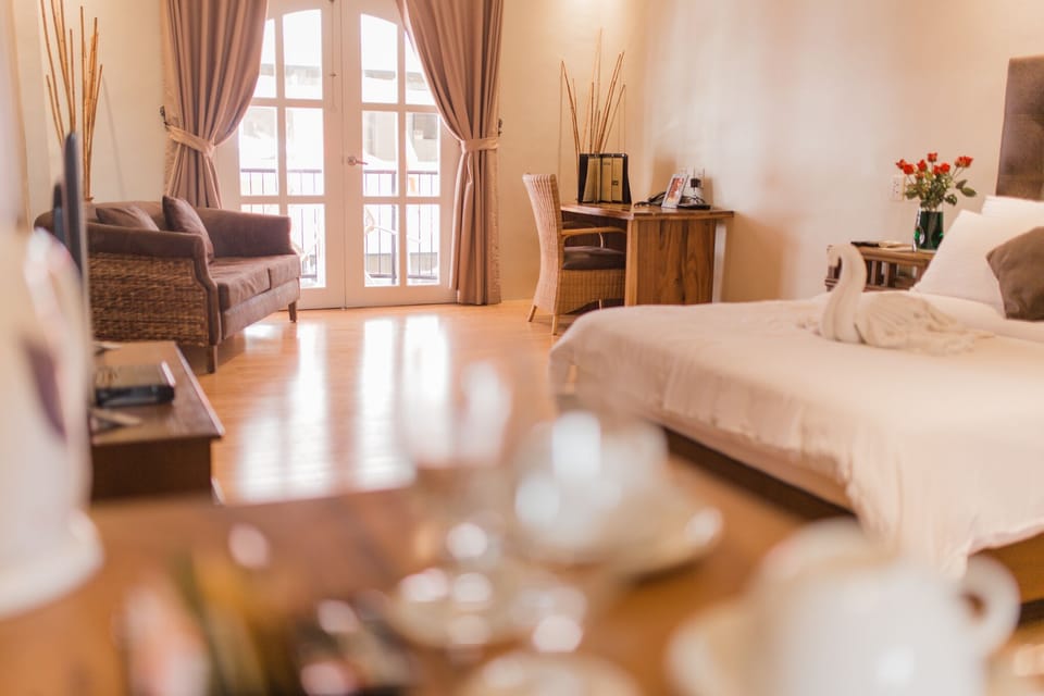 Deluxe Room, Balcony | Minibar, in-room safe, desk, blackout drapes