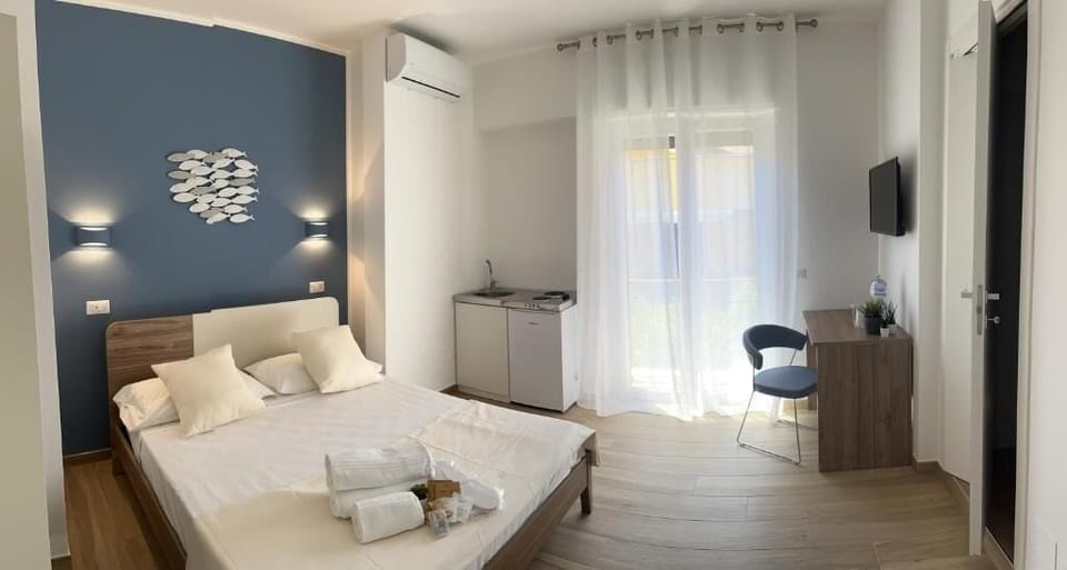 Deluxe Triple Room, Balcony, City View | In-room safe, blackout drapes, free WiFi