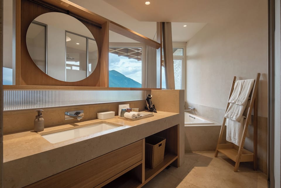 Family Suite | Bathroom | Rainfall showerhead, free toiletries, hair dryer, bathrobes