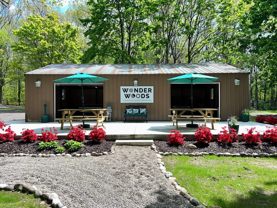 Outside of the game barn with a large patio.