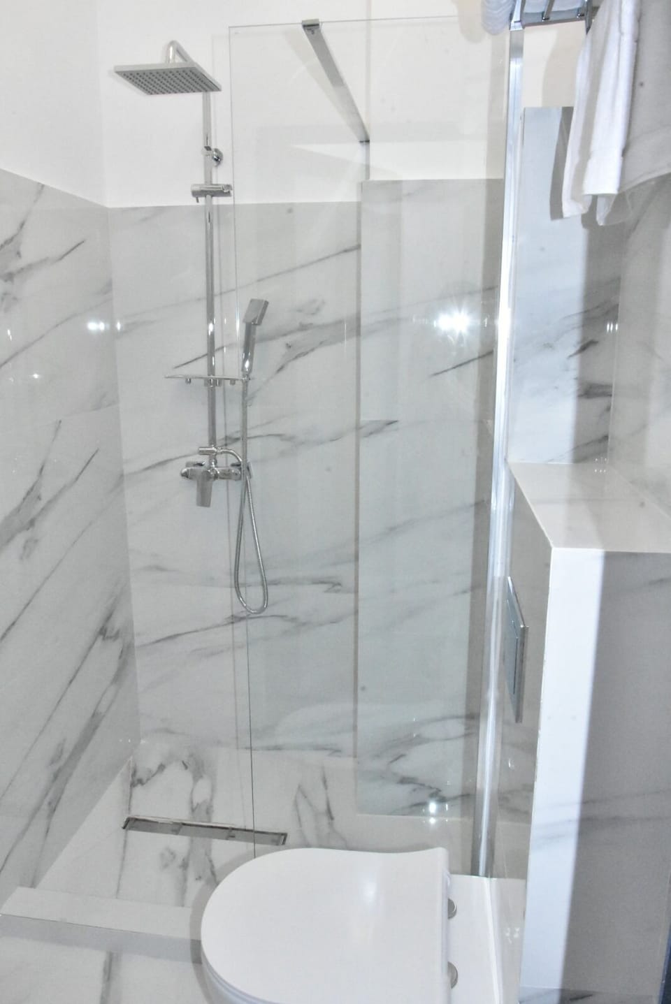 Shower, eco-friendly toiletries, hair dryer, towels