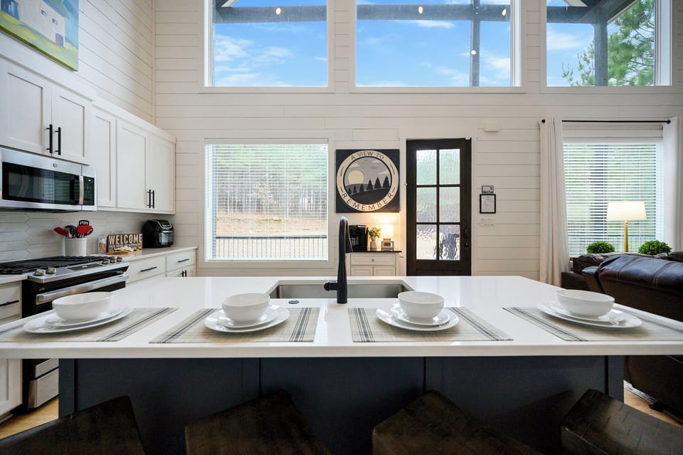 Bright, open kitchen overlooking the living space — modern comfort meets cabin style.