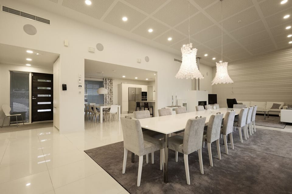 Spacious open-plan dining hall featuring designer lighting and high-end architectural finishes