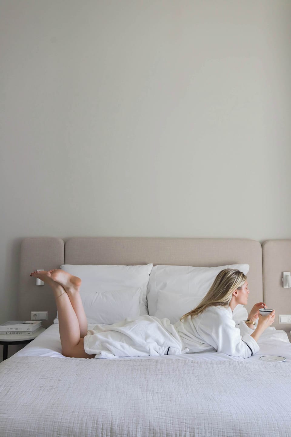 Unwind like home: relaxed, cozy and surrounded by soft materials in a light-filled room.