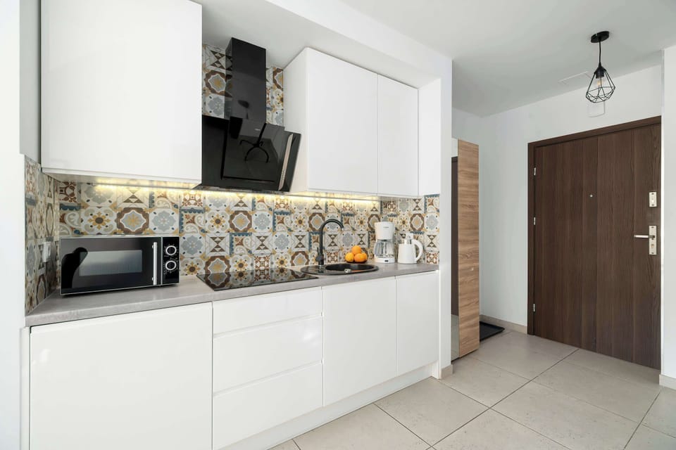 The fully equipped kitchenette includes everything you need for a home-cooked meal.