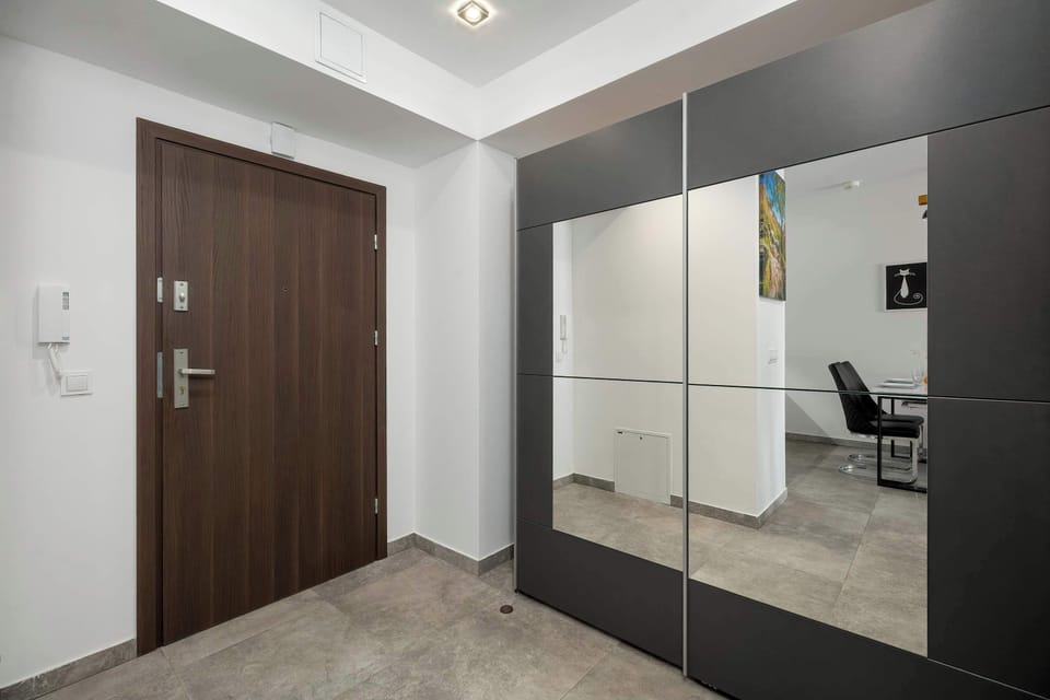 The living room's modern and stylish decor creates a welcoming atmosphere.