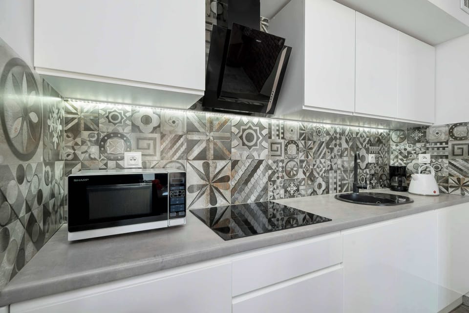 The fully equipped kitchenette includes everything you need for a home-cooked meal.