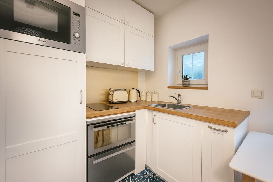 Apartment | Private kitchen | Fridge, oven, stovetop, cookware/dishes/utensils