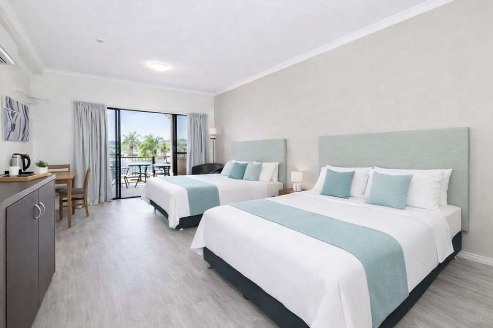 Spacious twin room with hotel-quality linen, modern styling, and open-plan layout ideal for families or groups.