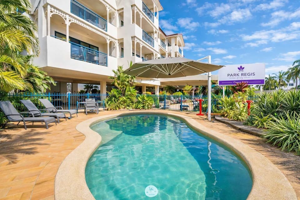 Lagoon-style swimming pool surrounded by tropical gardens — perfect for relaxing after a day exploring.