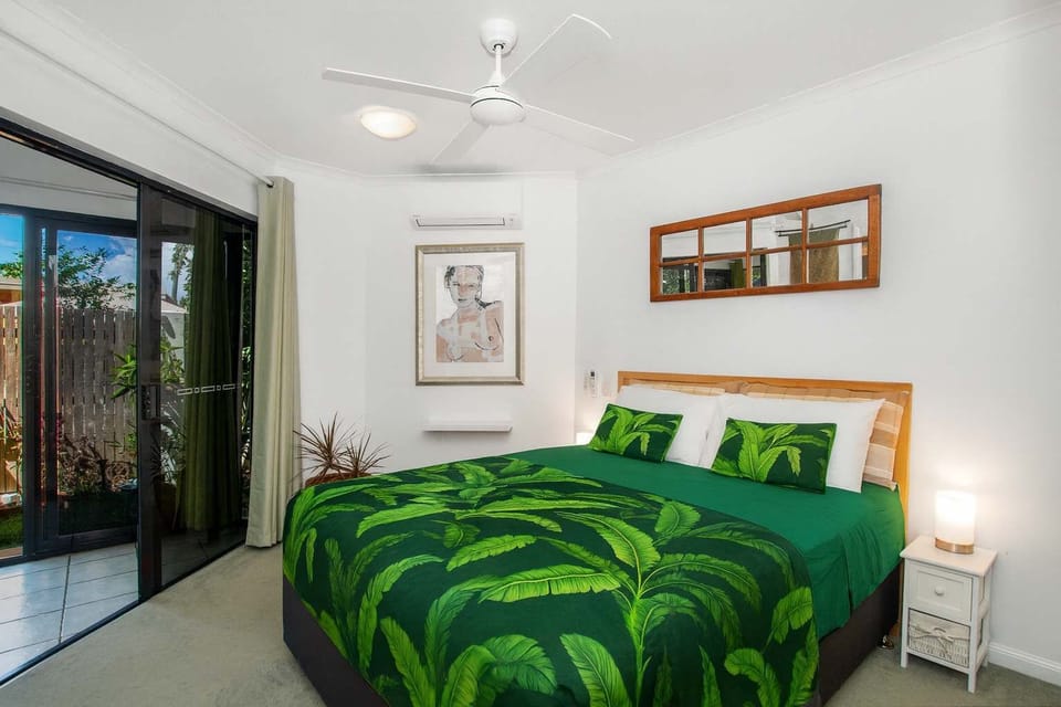 Light-Filled Tropical Bedroom with Private Patio Access