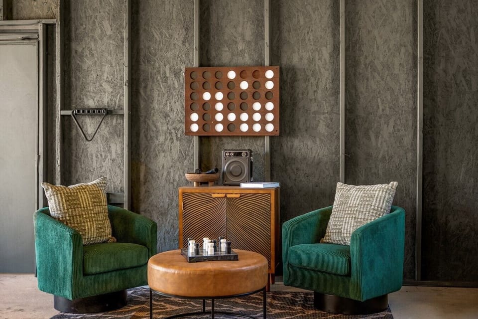 Luxury lounge spaces designed for relaxation and connection, featuring velvet seating, karaoke, games, and warm mountain-inspired décor perfect for unforgettable nights together