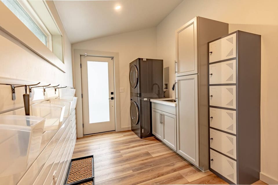 In house laundry and mud room for guest convenience