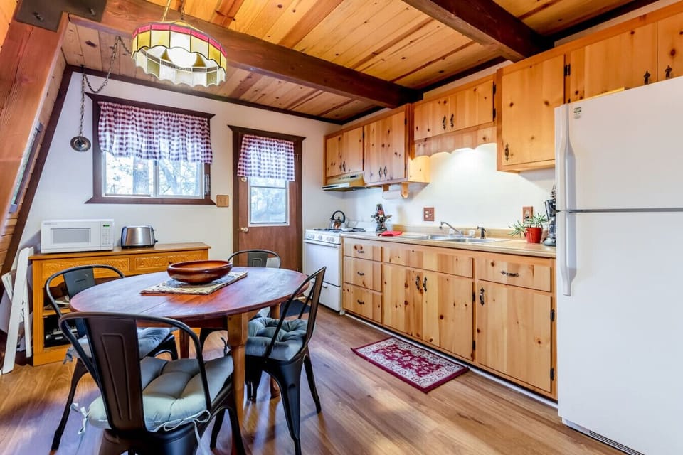 Rustic kitchen and dining space with cozy cabin charm