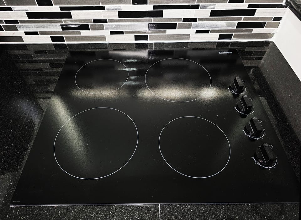 4 burner electric cook top in the kitchen.
