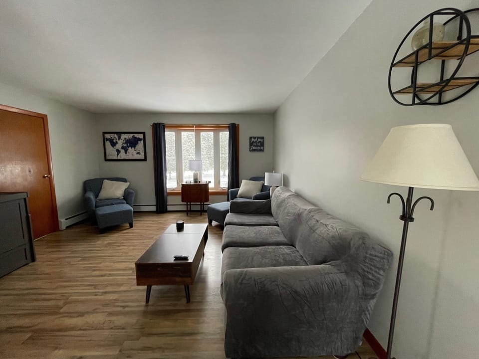 Relax and enjoy the comforts of home in the cozy living room. 
