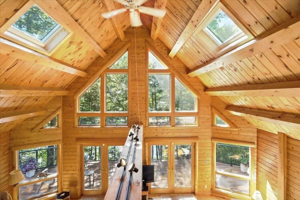 Mesmerizing Wood Beams, Sky Lights & easy French Door access to Maine Lake Front Living