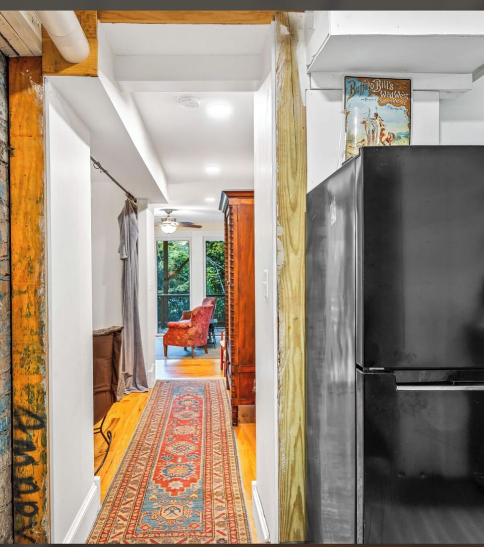 Hallway from Kitchen to outside.Two levels (two steps) down.