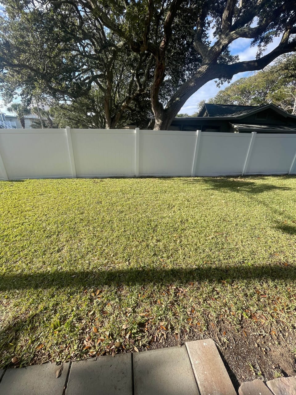Roomy shared grassy area , not fully fenced