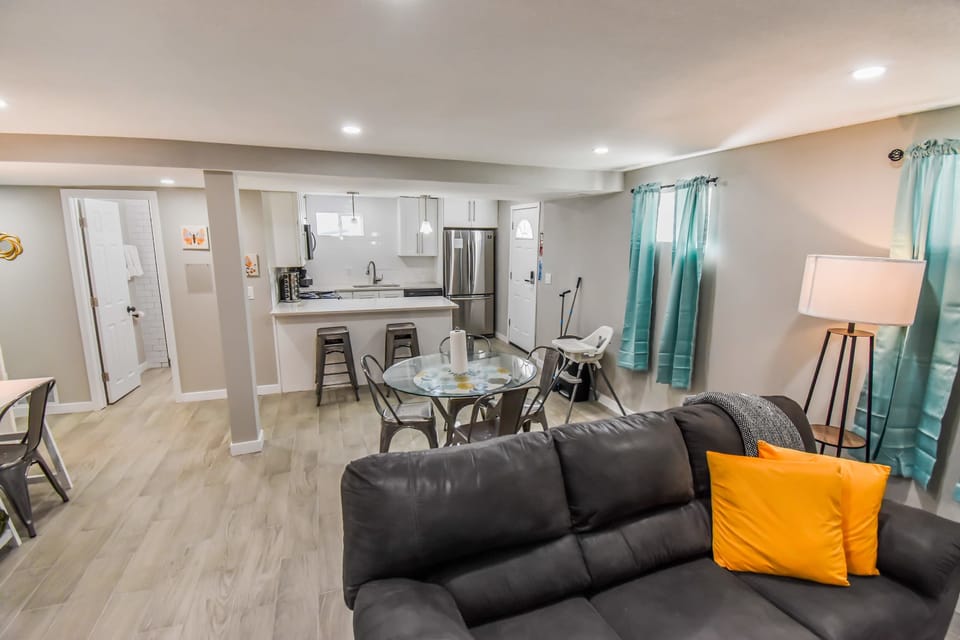 The living room showcases elegance with its chic decor, refined furnishings, and carefully curated accents, creating a perfect space to unwind in both comfort and style.